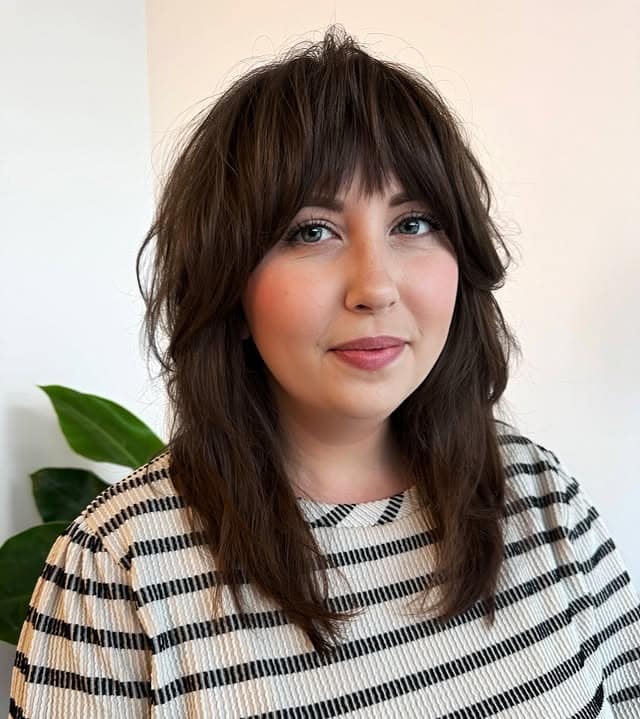 4. Deep Brunette Medium Shag with Full Bangs - Shaggy Haircut