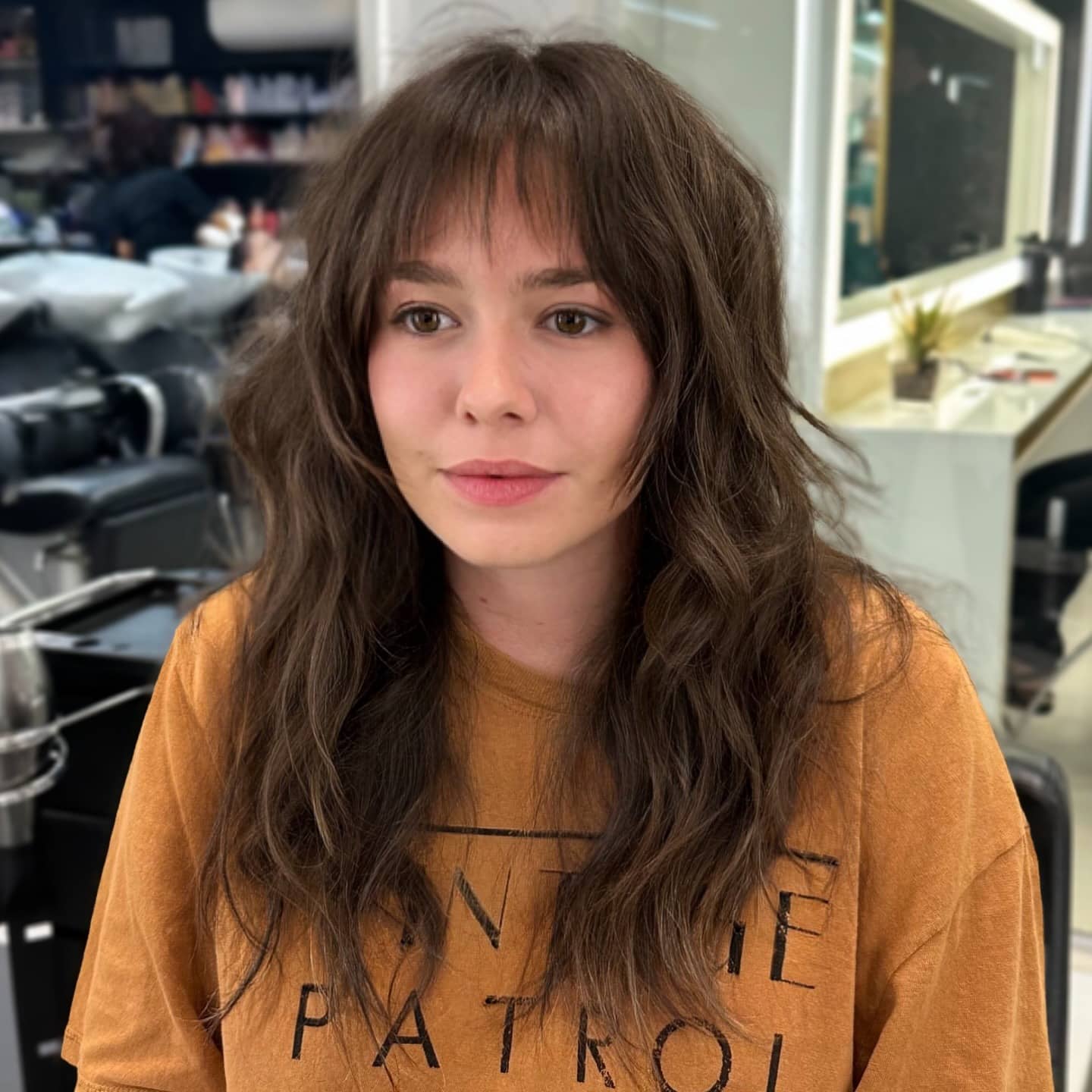 9. Ash Brown Voluminous Shag with Feathered Bangs - Shaggy Haircut