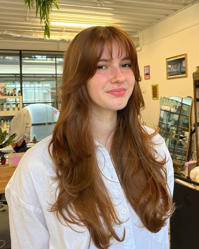 13. Golden Auburn Long Shag with Curtain Bangs - Shaggy Haircut