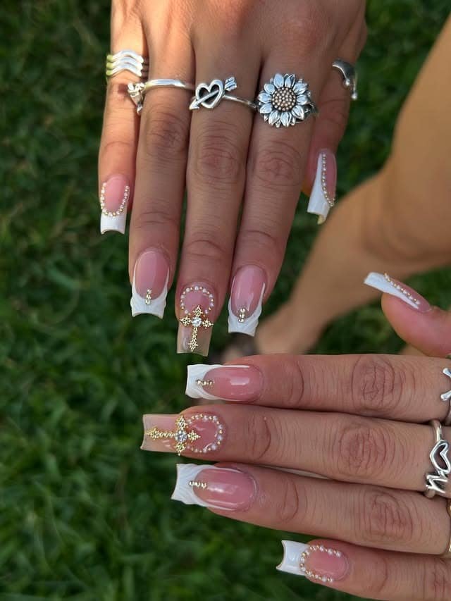 4. White French Tip Cross Nails with Gold Rhinestones - cross nail ideas