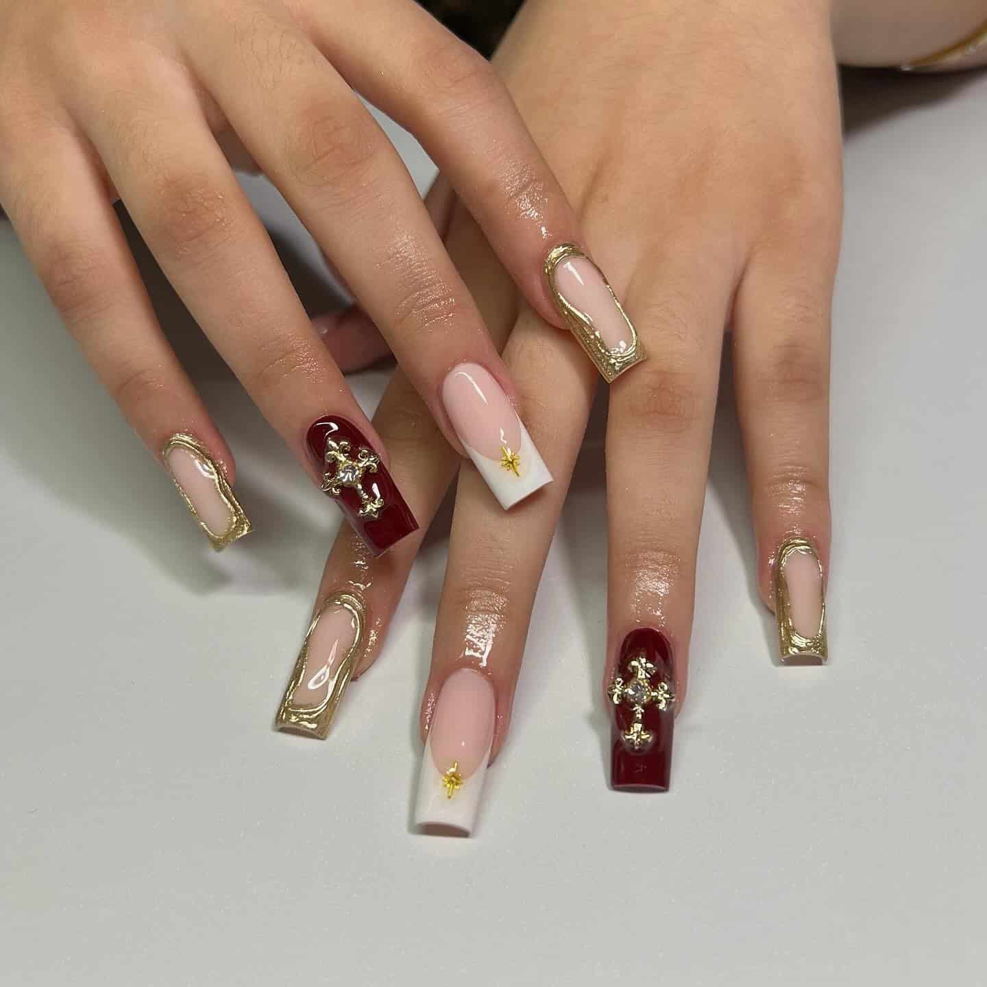 7. Burgundy and Gold Cross Square Nails - cross nail ideas