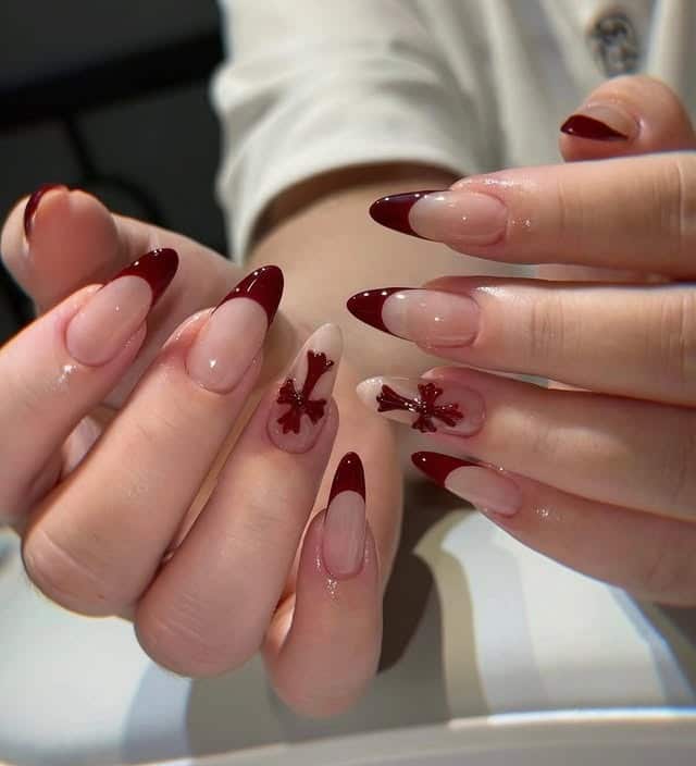 13. Burgundy French Tip Almond Nails with Cross Accents - cross nail ideas