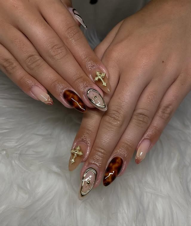 14. Tortoiseshell Brown and Gold Cross Almond Nails - cross nail ideas