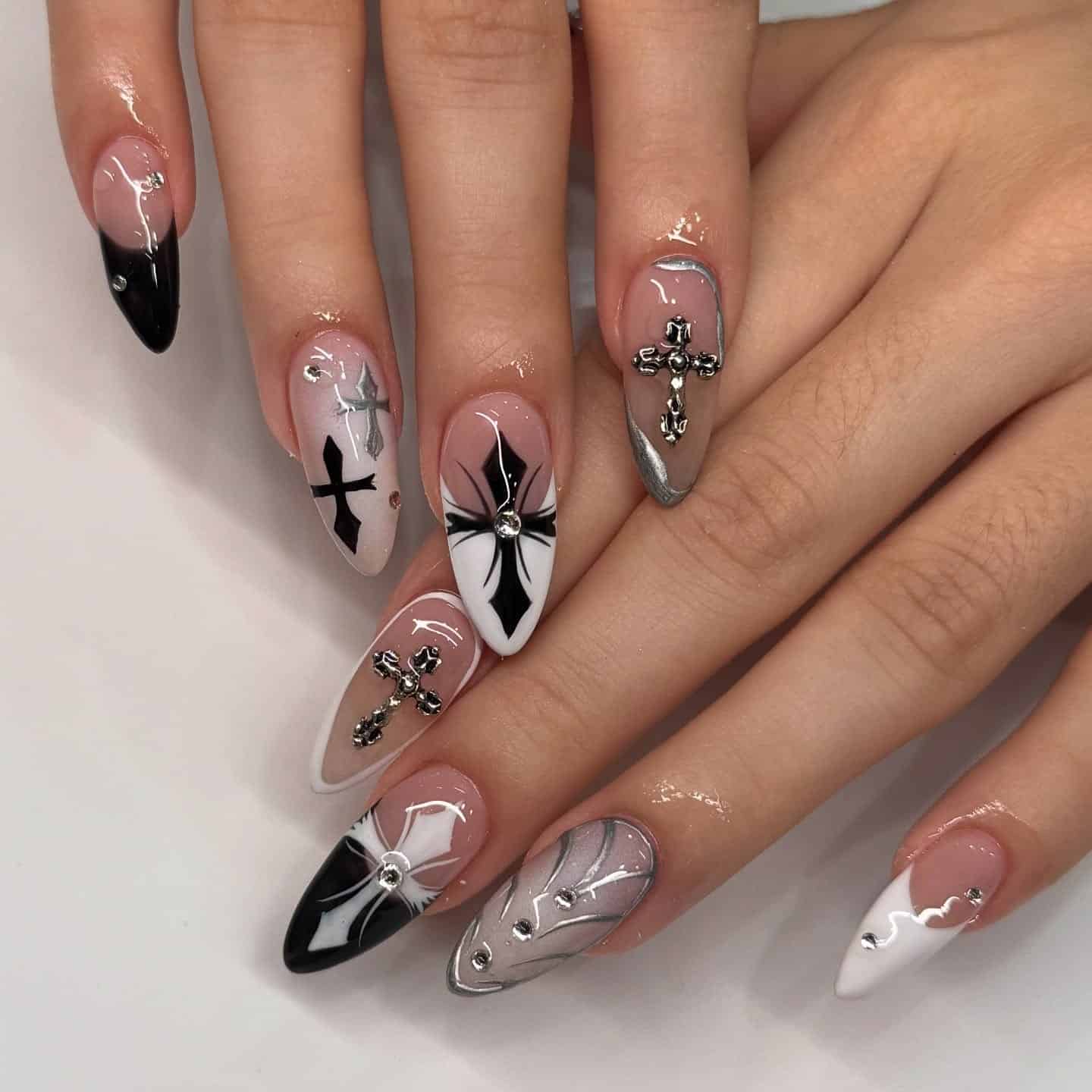 15. Black and Silver Gothic Cross Stiletto Nails - cross nail ideas