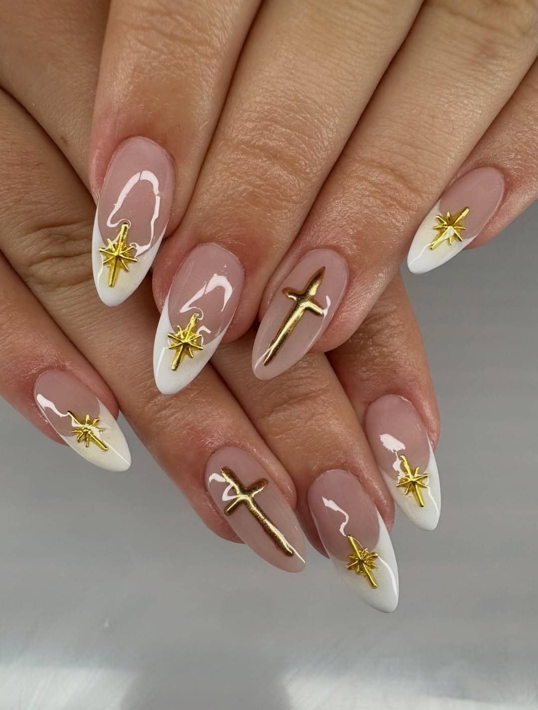 17. White French Tip Almond Nails with Gold Cross Charms - cross nail ideas
