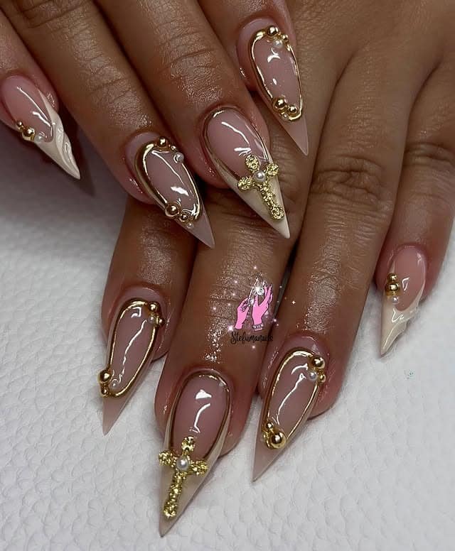 18. Nude Pink Stiletto Nails with Gold Cross Details - cross nail ideas