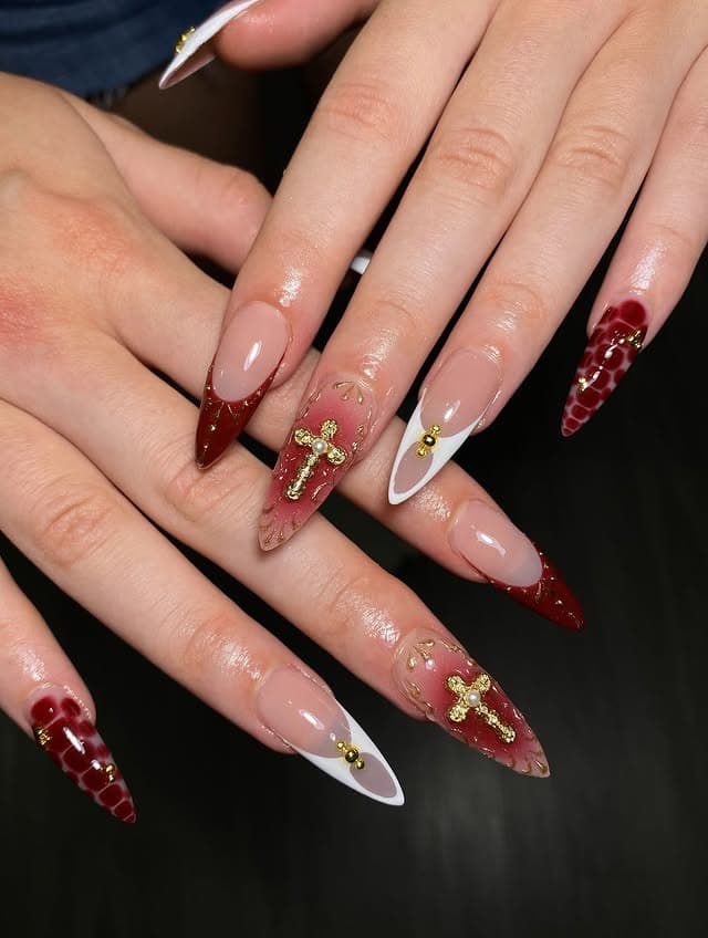 20. Burgundy and Gold Cross Stiletto Nails - cross nail ideas