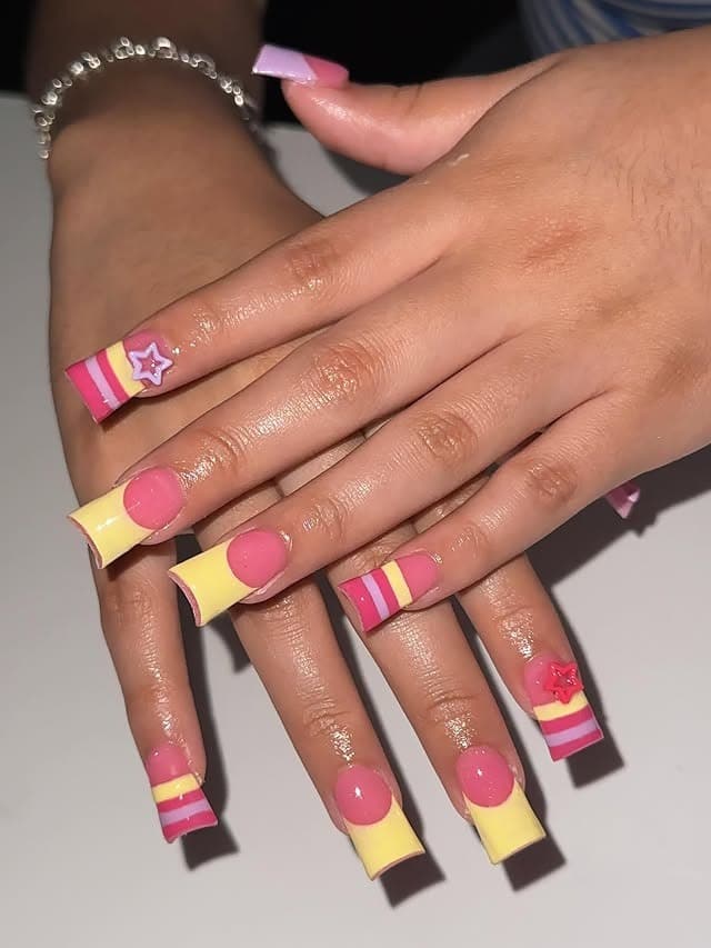 1. Pink and Yellow Striped Duck Nails with Star Accents - duck nail ideas