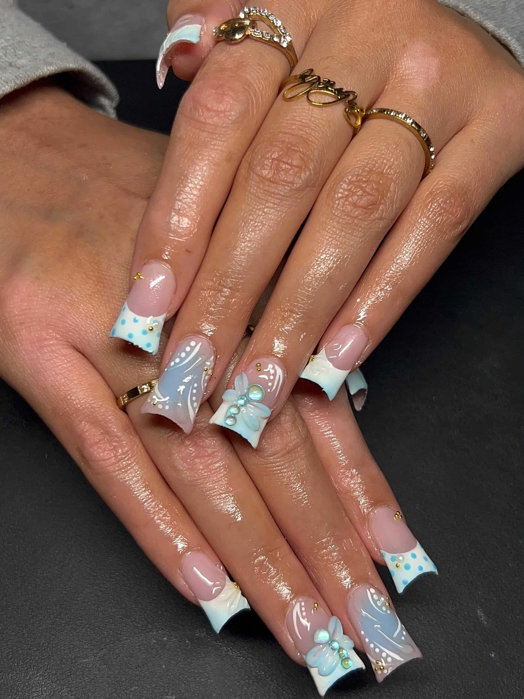 11. Baby Blue and White Floral Duck Nails - duck nail ideas