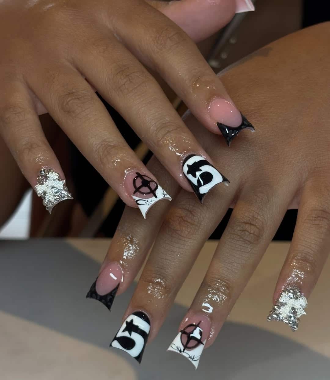 13. Black and White Graphic Duck Nails with Silver Charms - duck nail ideas