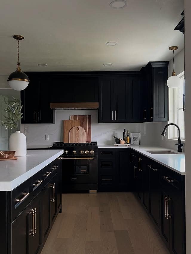 20. Timeless Black and White Kitchen with Brass Hardware - black kitchen decor ideas