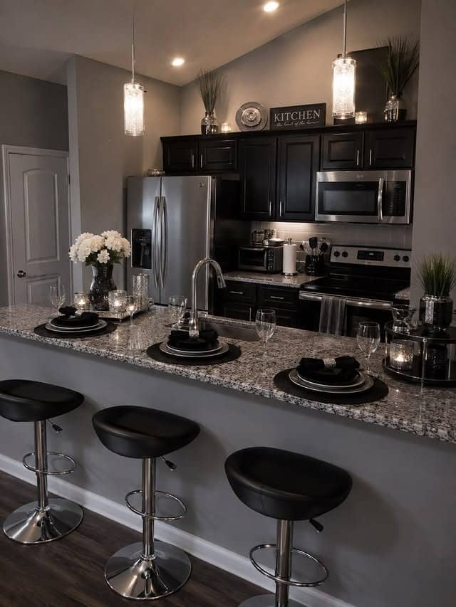21. Elegant Black and Gray Kitchen with Granite Breakfast Bar - black kitchen decor ideas