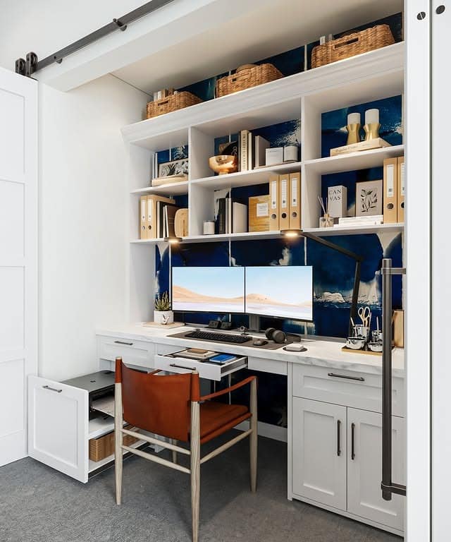 3. Crisp White and Navy Blue Built-In Closet Office Idea - closet office ideas