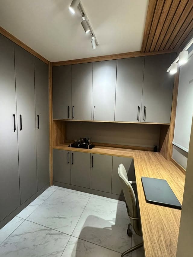 20. Modern Taupe Gray and Light Oak Minimalist Closet Office Idea - closet office ideas