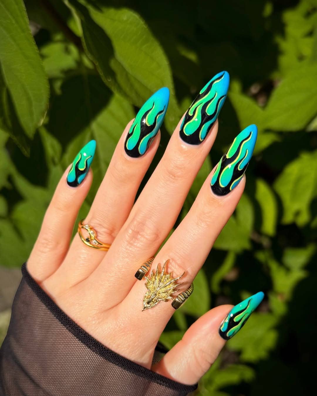 1. Turquoise and Green Flame Stiletto Nails - flame nail ideas