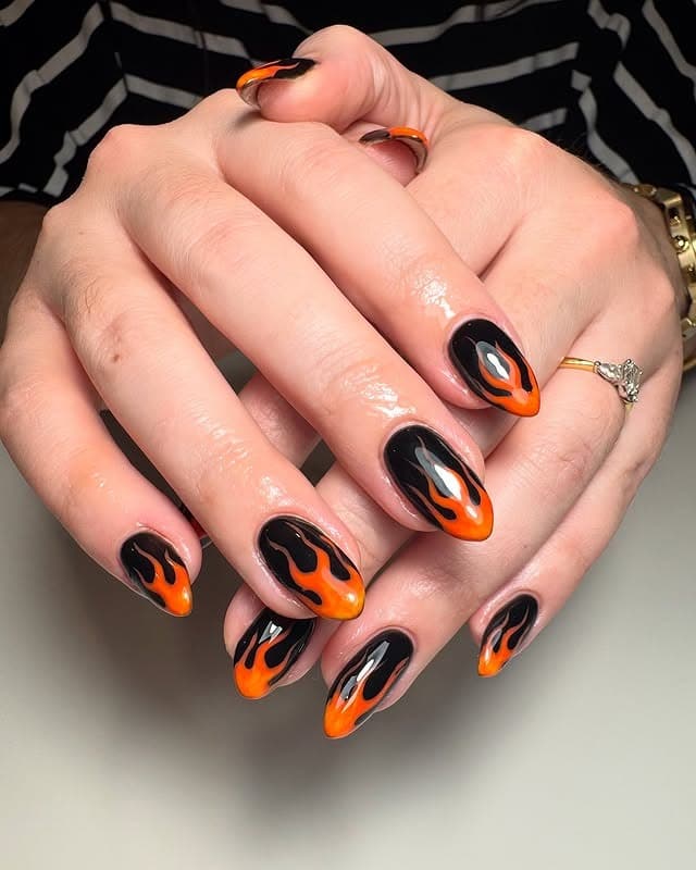 10. Black and Orange Flame Almond Nails - flame nail ideas