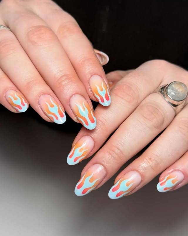 13. Pastel Blue and Orange Flame Almond Nails - flame nail ideas