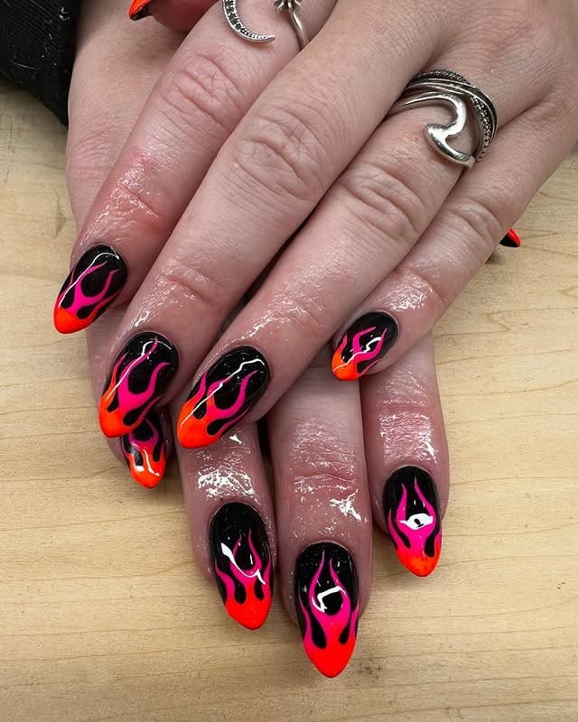 21. Black and Neon Pink Flame Almond Nails - flame nail ideas