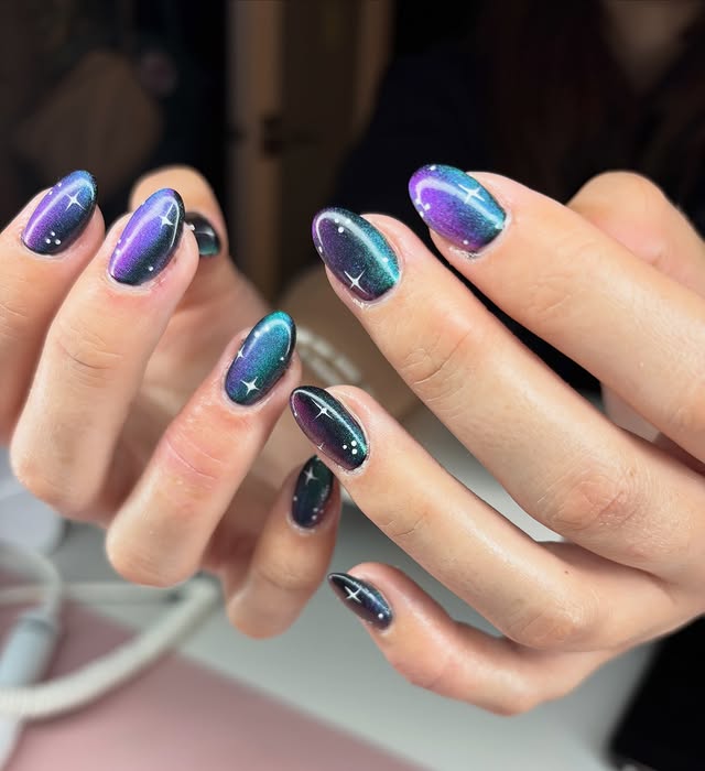 5. Teal and Violet Magnetic Galaxy Short Almond Nails - galaxy nail ideas