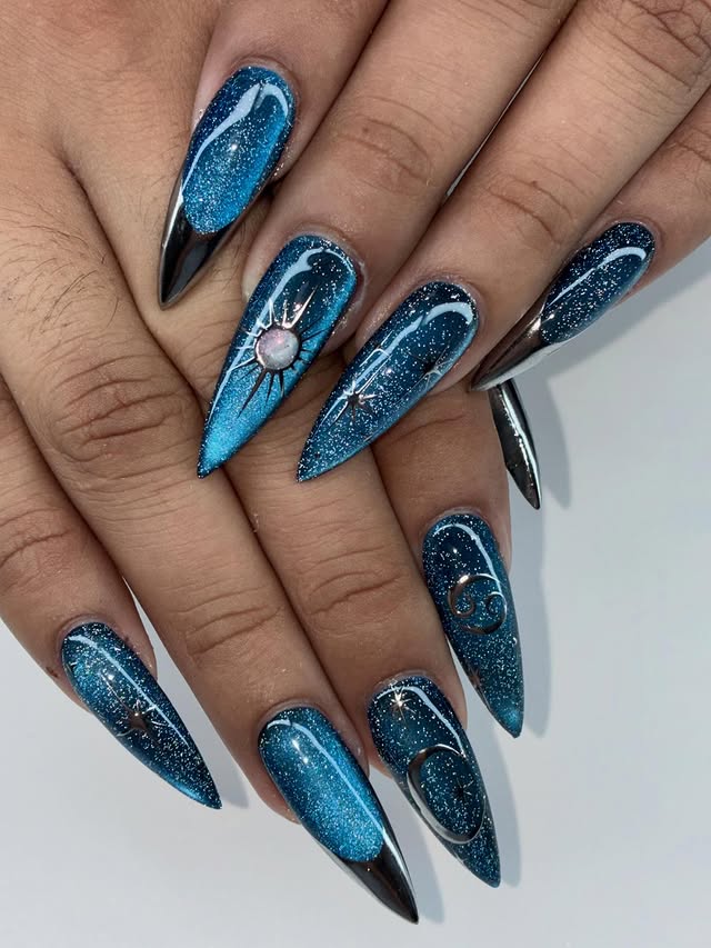7. Sapphire Blue Glitter Galaxy Stiletto Nails - galaxy nail ideas
