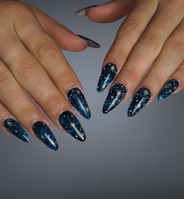 9. Midnight Navy and Gold Starry Galaxy Almond Nails - galaxy nail ideas