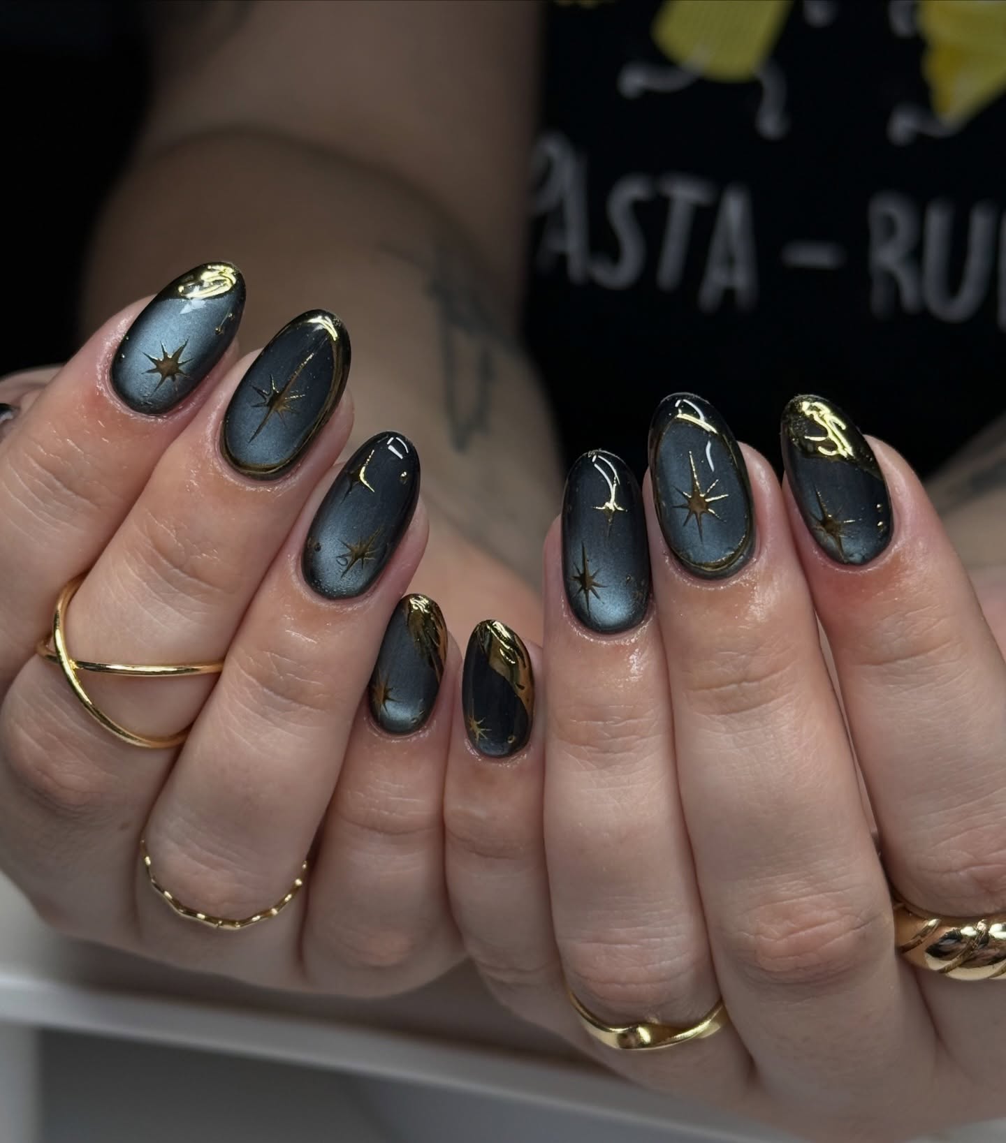 10. Charcoal Black and Gold Celestial Galaxy Oval Nails - galaxy nail ideas