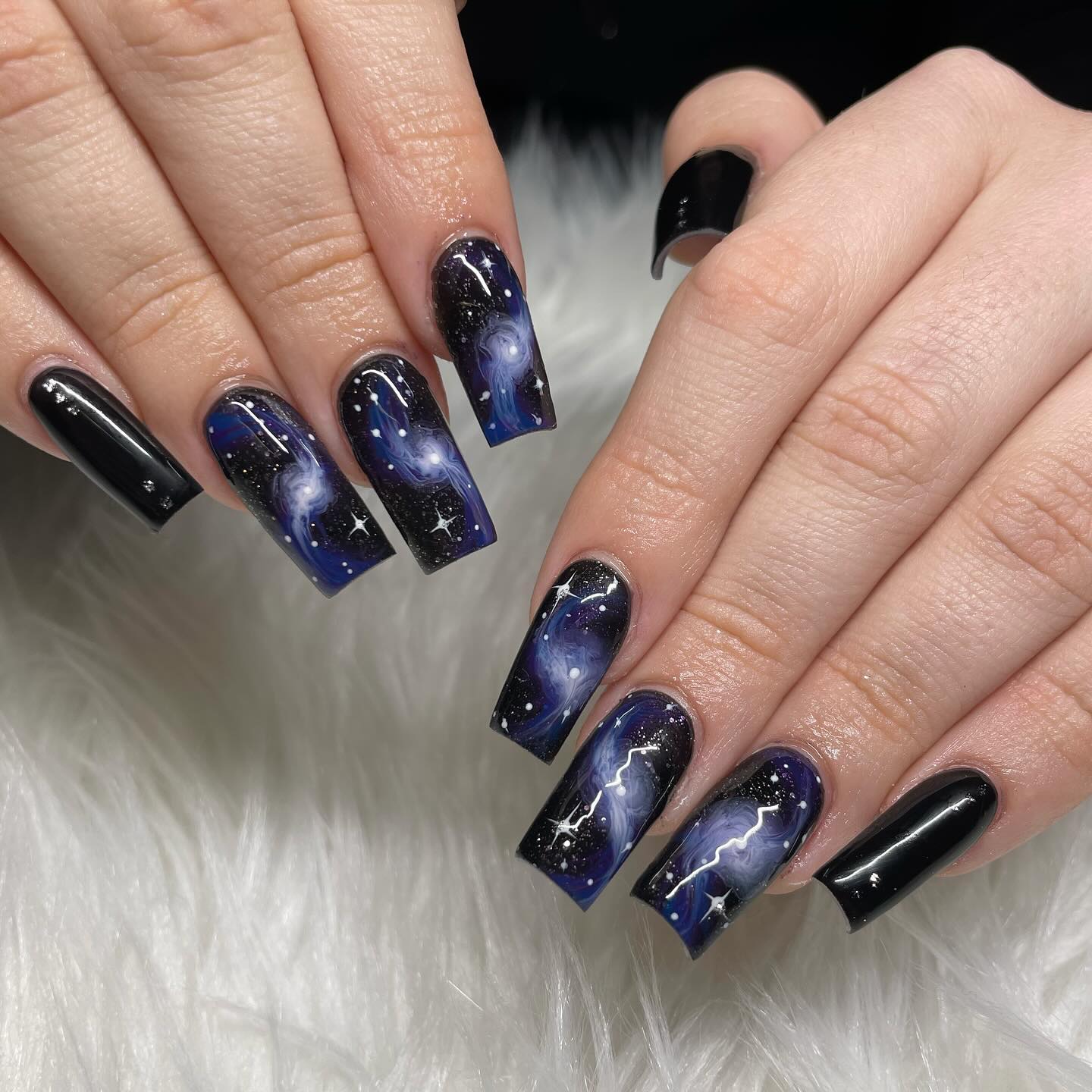 11. Midnight Black and Purple Spiral Galaxy Coffin Nails - galaxy nail ideas