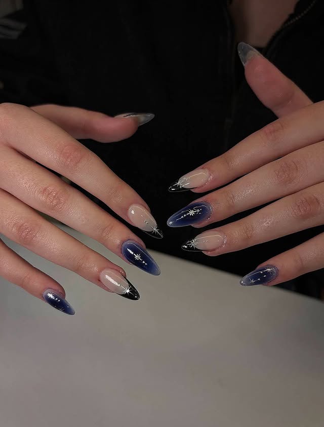 14. Midnight Blue and Nude Galaxy French Tip Stiletto Nails - galaxy nail ideas