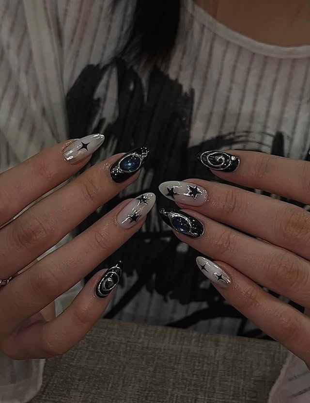 16. Black and Silver Chrome Orbit Galaxy Almond Nails - galaxy nail ideas
