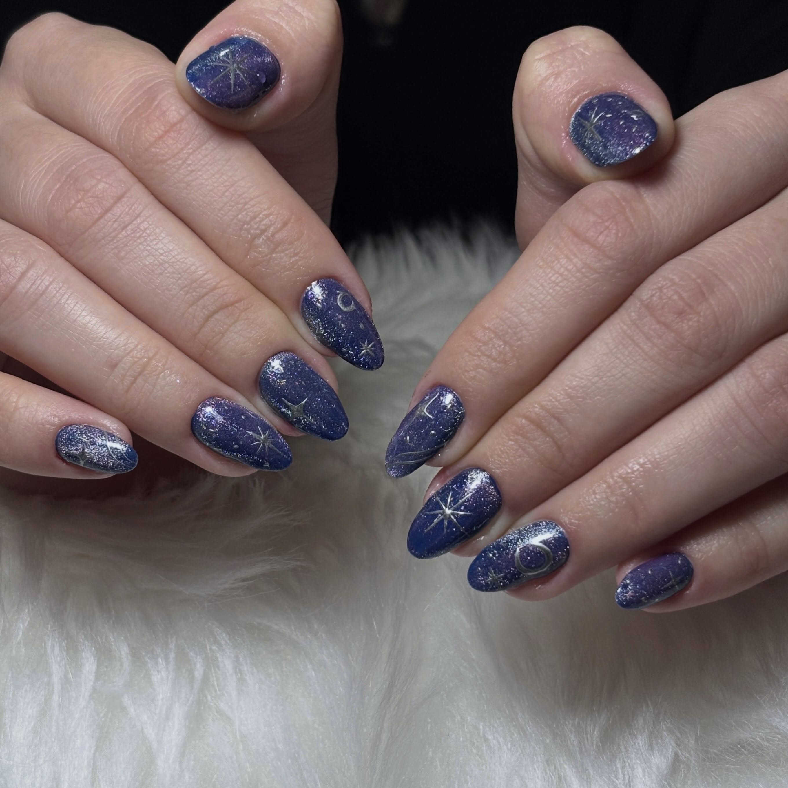 17. Purple and Silver Glitter Galaxy Almond Nails - galaxy nail ideas