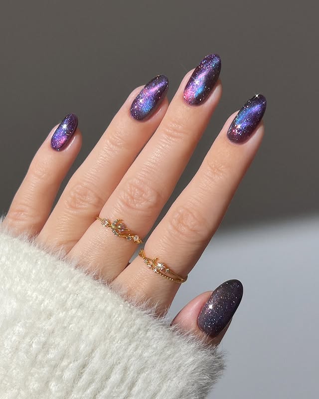 21. Purple and Pink Shimmer Galaxy Almond Nails - galaxy nail ideas