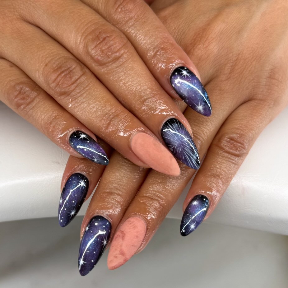 22. Midnight Purple and Peach Starry Galaxy Stiletto Nails - galaxy nail ideas