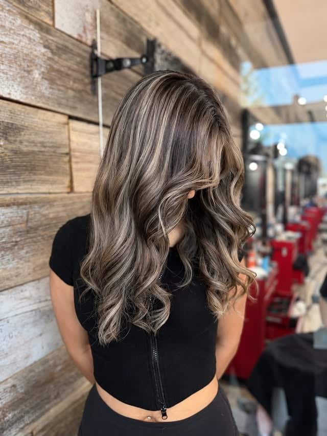 13. Smoky Ash Blonde Highlights on Shoulder-Length Curls - Hair Color with Highlights