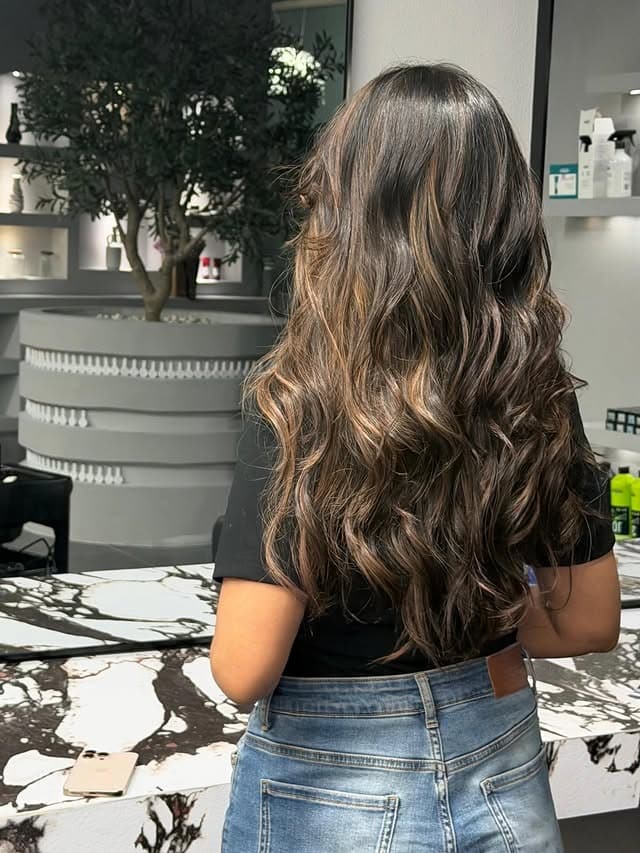 17. Golden Caramel Highlights on Long Chocolate Brown Curls - Hair Color with Highlights