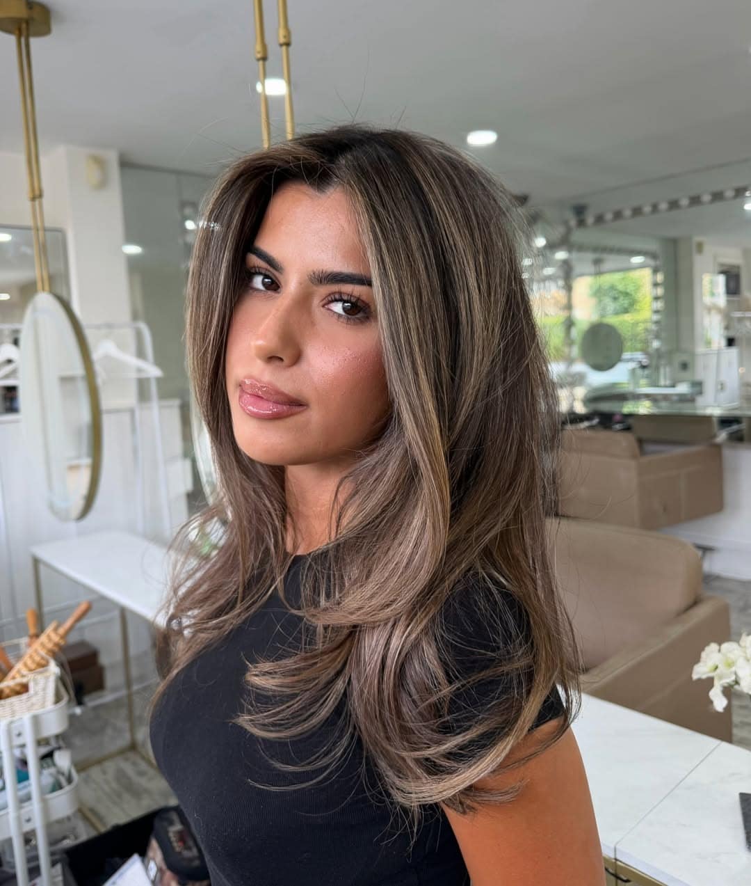 20. Cool Beige Highlights on a Shoulder-Length Layered Blowout - Hair Color with Highlights