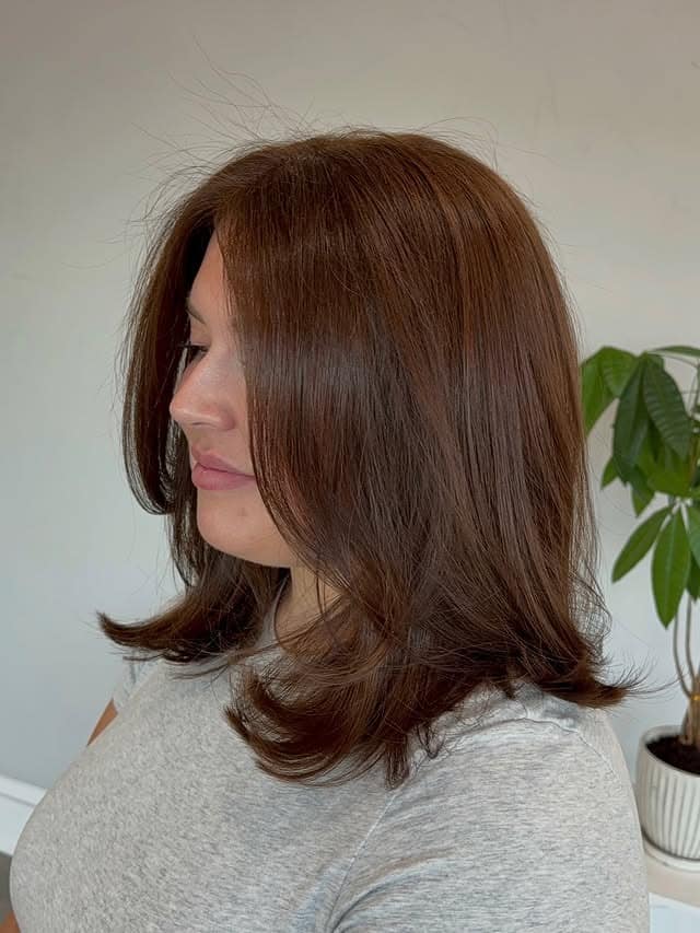 4. Warm Chestnut Brown Medium-Length Cut with Feathered Ends - Chic-Length Hairstyles