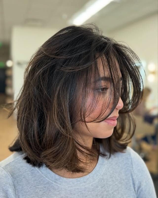 5. Espresso Brown Textured Bob with Wispy Curtain Bangs - Chic-Length Hairstyles