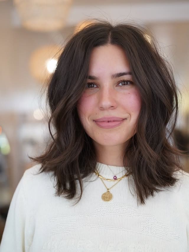 10. Deep Chocolate Brunette Shaggy Lob with Curtain Bangs - Chic-Length Hairstyles