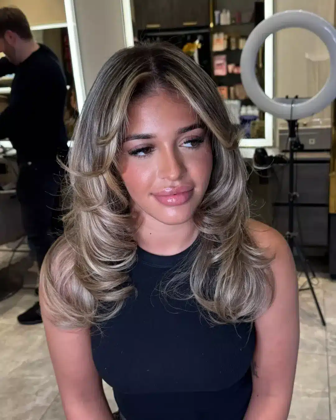 12. Ash Blonde Layered Butterfly Cut with Voluminous Curtain Bangs - Chic-Length Hairstyles