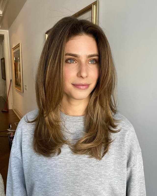 15. Caramel Brown Butterfly Haircut with Bouncy Feathered Layers - Chic-Length Hairstyles