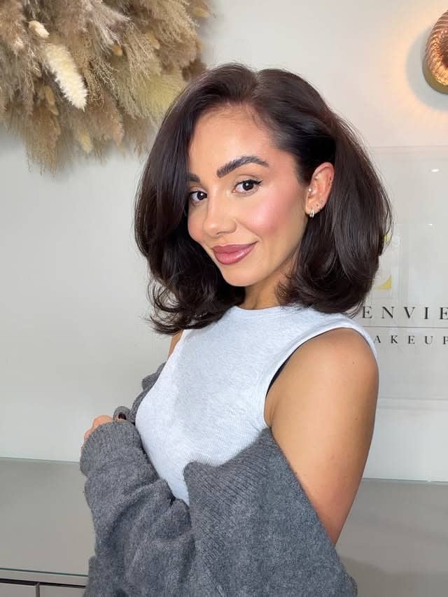 17. Dark Espresso Brown Voluminous Bob with Deep Side Part - Chic-Length Hairstyles