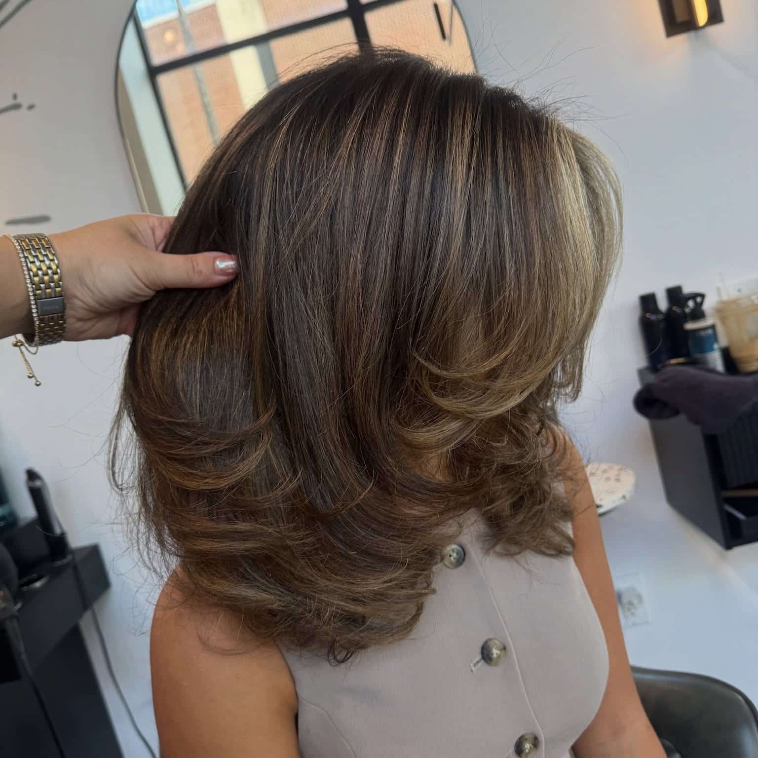 22. Chocolate Brown Layered Butterfly Cut with Caramel Highlights - Chic-Length Hairstyles
