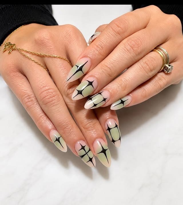3. Sage Green and Black Geometric Starburst Nails - geometric nail ideas