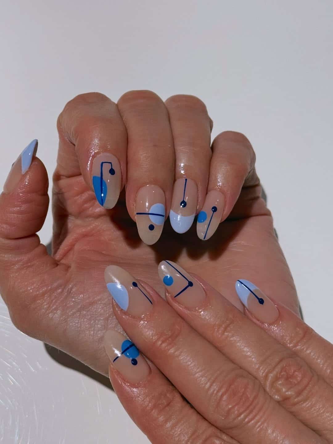 16. Baby Blue and Navy Geometric Dot Nails - geometric nail ideas