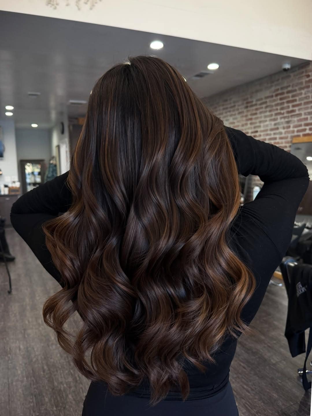 22. Rich Chocolate Brunette Balayage with Cascading Glossy Waves - Brunette Balayage Hair Color