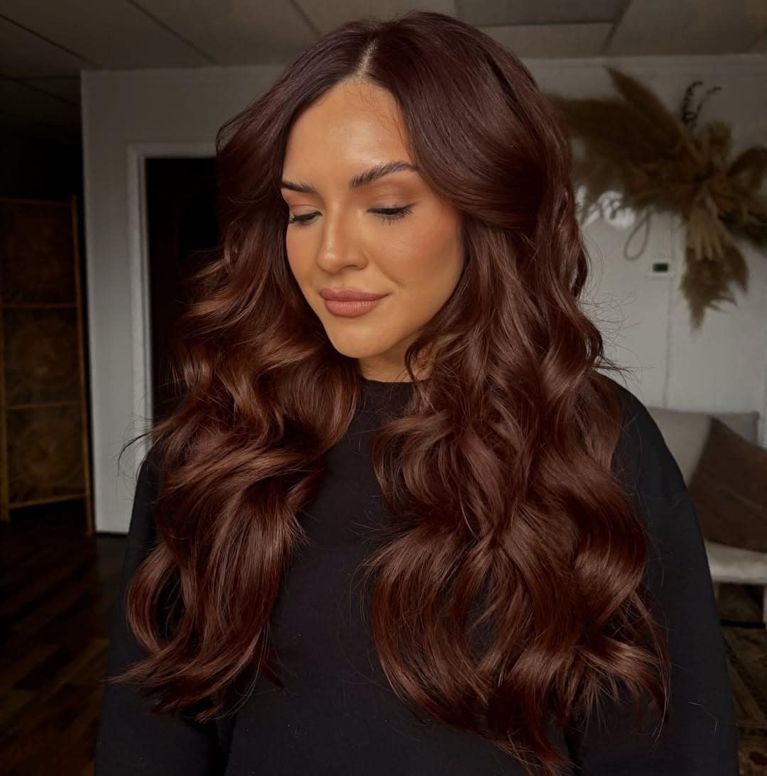 1. Rich Dark Auburn Hair with Long Voluminous Waves - Dark Auburn Hair Color