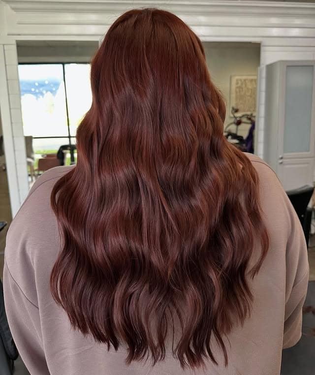 5. Glossy Mahogany Auburn Hair with Long S-Shaped Waves - Dark Auburn Hair Color