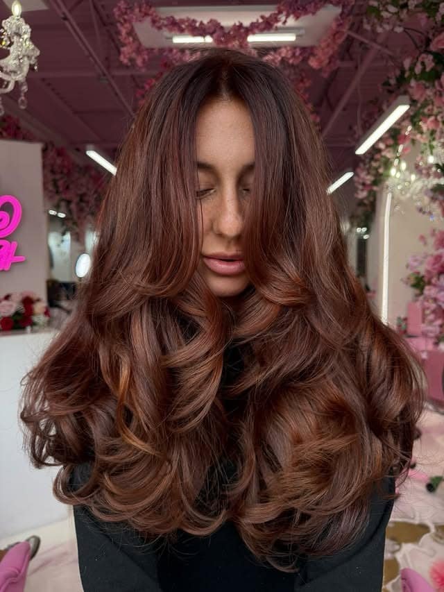 11. Rich Copper Auburn Hair with Voluminous Butterfly Layers - Dark Auburn Hair Color