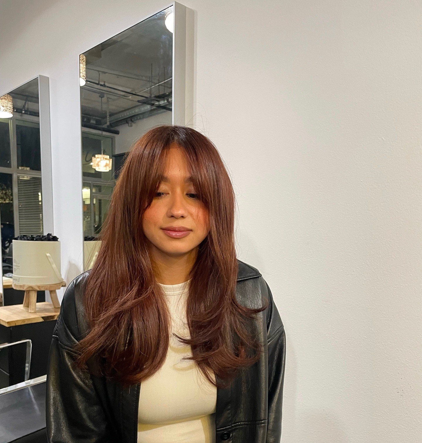 16. Soft Cinnamon Auburn Hair with Feathered Layers and Curtain Bangs - Dark Auburn Hair Color