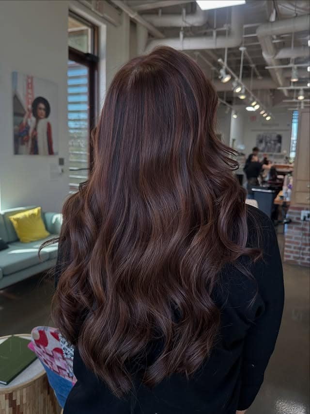 19. Dark Wine Auburn Hair with Long Polished Waves - Dark Auburn Hair Color